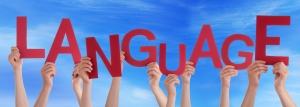 Many People Hands Holding Red Word Language Blue Sky